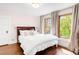 Bedroom with large windows, hardwood floors, and natural light at 1220 S Vine St, Denver, CO 80210