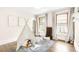Cozy bedroom with hardwood floors, decorative tent, and bright natural light at 1220 S Vine St, Denver, CO 80210