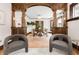 Inviting dining room with hardwood floors, crystal chandelier, built-in hutch, and stylish gray chairs at 1220 S Vine St, Denver, CO 80210