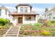 Beautiful exterior of home with front yard landscaping and a stone walkway at 1220 S Vine St, Denver, CO 80210