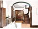 Elegant foyer with wooden staircase, coat rack, and hardwood floors at 1220 S Vine St, Denver, CO 80210