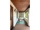 Inviting front porch with rocking chairs, stylish rug and a wood-paneled ceiling at 1220 S Vine St, Denver, CO 80210