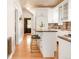 View of a kitchen and entryway featuring stainless steel appliances, and light stone countertops at 1220 S Vine St, Denver, CO 80210