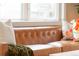 Stylish living room featuring a tan leather sofa and a comfortable blanket at 1220 S Vine St, Denver, CO 80210