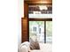 Cozy living room detail featuring a leaded glass window with vintage shutters at 1220 S Vine St, Denver, CO 80210