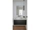 Elegant powder room featuring a vessel sink, black hardware, floating vanity and modern light fixture at 1601 Park Ave # 214, Denver, CO 80218