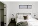 Cozy bedroom featuring a comfortable bed and stylish bedside tables with lamps at 1601 Park Ave # 214, Denver, CO 80218