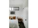 Well-lit bedroom features a sliding closet door and modern minimalist decor at 1601 Park Ave # 214, Denver, CO 80218