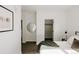 Minimalist bedroom design with closet space and a round mirror in the hallway at 1601 Park Ave # 214, Denver, CO 80218