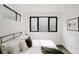 Bright bedroom featuring a modern bed frame, and a large window for natural light at 1601 Park Ave # 214, Denver, CO 80218