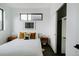 Chic bedroom featuring closet, ample natural light, and contemporary decor at 1601 Park Ave # 214, Denver, CO 80218