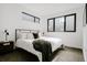 Bright bedroom with a comfortable bed, stylish furnishings, and natural light streaming in through the windows at 1601 Park Ave # 214, Denver, CO 80218