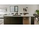 Modern kitchen with sleek cabinets, stainless steel appliances, and a spacious island with bar seating at 1601 Park Ave # 214, Denver, CO 80218