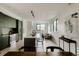 Bright, open-concept living area with modern kitchen and large windows allowing for ample natural light at 1601 Park Ave # 214, Denver, CO 80218