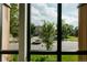 Bright view from a window showcasing the neighborhood with greenery and street views at 1601 Park Ave # 214, Denver, CO 80218
