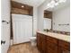 A full bathroom features a vanity with granite countertop and a shower with decorative tile at 1505 Castlecombe Ln, Monument, CO 80132