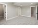 Neutral bedroom with carpet and trim, showcasing doors and an open doorway, bathed in soft light at 1505 Castlecombe Ln, Monument, CO 80132