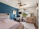 Bedroom with a plush bed, work station and a window overlooking the verdant outdoor landscape at 1505 Castlecombe Ln, Monument, CO 80132