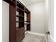 A walk-in closet features custom shelving and drawers, offering ample storage space at 1505 Castlecombe Ln, Monument, CO 80132