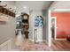 Inviting entryway that opens to a living room with a stone fireplace and vaulted ceilings at 1505 Castlecombe Ln, Monument, CO 80132