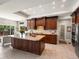 Gourmet kitchen with custom wood cabinets, granite countertops, stainless steel appliances and tiled flooring at 1505 Castlecombe Ln, Monument, CO 80132