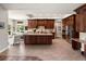 Spacious kitchen with a large island, stainless steel appliances and seamless access to the living room and breakfast nook at 1505 Castlecombe Ln, Monument, CO 80132
