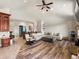 Spacious living room featuring vaulted ceilings, wood floors and a large, comfortable sectional sofa at 1505 Castlecombe Ln, Monument, CO 80132
