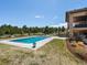 A large in-ground pool surrounded by well-maintained landscaping, perfect for outdoor enjoyment at 1505 Castlecombe Ln, Monument, CO 80132