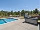 Inviting backyard pool and hot tub area with beautiful landscaping and ample space for relaxation and entertainment at 1505 Castlecombe Ln, Monument, CO 80132