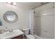 A well-maintained bathroom with a shower-tub combo and classic design at 2843 Havana St, Denver, CO 80238