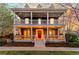 Charming two-story home featuring a covered front porch and balcony at 2843 Havana St, Denver, CO 80238