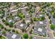 Aerial view of a residential community with a pool and well-manicured landscaping at 1670 S Deframe St # B2, Lakewood, CO 80228
