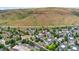Residential area aerial view showcasing community layout against mountain backdrop at 1670 S Deframe St # B2, Lakewood, CO 80228
