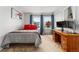 Cozy bedroom with a desk, natural light, and a window overlooking the neighborhood at 1670 S Deframe St # B2, Lakewood, CO 80228