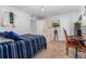 Bedroom with neutral carpet, desk, ensuite bathroom and an open closet space at 1670 S Deframe St # B2, Lakewood, CO 80228