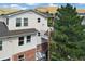 Exterior of a multi-story condo featuring brick accents and access stairs at 1670 S Deframe St # B2, Lakewood, CO 80228