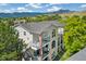 A beautiful three-story condo with balconies overlooking lush greenery and mountain view at 1670 S Deframe St # B2, Lakewood, CO 80228