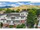 Exterior shot of condos featuring balconies, brick accents, and meticulous landscaping at 1670 S Deframe St # B2, Lakewood, CO 80228