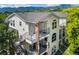 Inviting condo showcases multiple balconies, brick accents, metal railings and mountain views, ideal for outdoor living at 1670 S Deframe St # B2, Lakewood, CO 80228