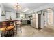 Well-lit kitchen with barstool seating, stainless steel appliances, and stylish green cabinetry providing a modern feel at 1670 S Deframe St # B2, Lakewood, CO 80228