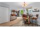 Open-concept living room with a dining area, natural light, and a cozy sitting space at 1670 S Deframe St # B2, Lakewood, CO 80228