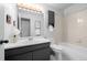 Bright bathroom featuring modern vanity, lighting, bathtub and updated fixtures at 6844 Countryside Ln # 284, Niwot, CO 80503