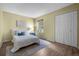 Cozy bedroom featuring hardwood floors, closet, and a window for natural light at 6844 Countryside Ln # 284, Niwot, CO 80503