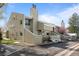 Exterior shot of multi-level condominium with muted-green siding and snow on the ground at 6844 Countryside Ln # 284, Niwot, CO 80503