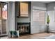 Inviting fireplace provides warmth and character in living room with an adjacent sliding glass door for natural light at 6844 Countryside Ln # 284, Niwot, CO 80503