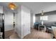 Hallway and dining nook featuring wood floors, closet and modern lighting, creating a transitional space with neutral tones at 6844 Countryside Ln # 284, Niwot, CO 80503