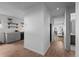 Bright interior view of a home featuring wood floors, white walls, and an open concept kitchen/living area at 6844 Countryside Ln # 284, Niwot, CO 80503