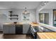 Corner view of modern kitchen featuring open shelving, new stainless steel appliances, and butcher block countertops at 6844 Countryside Ln # 284, Niwot, CO 80503