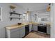 Well-lit kitchen with butcher block countertops, new stainless steel appliances, and a view to the living room at 6844 Countryside Ln # 284, Niwot, CO 80503
