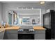 Kitchen featuring stainless steel stove and butcher block countertops with view of open living area at 6844 Countryside Ln # 284, Niwot, CO 80503